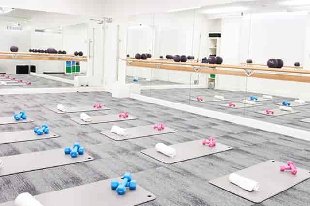 Barrecore Wandsworth fitness studio with colorful weights, ideal for wellness events.