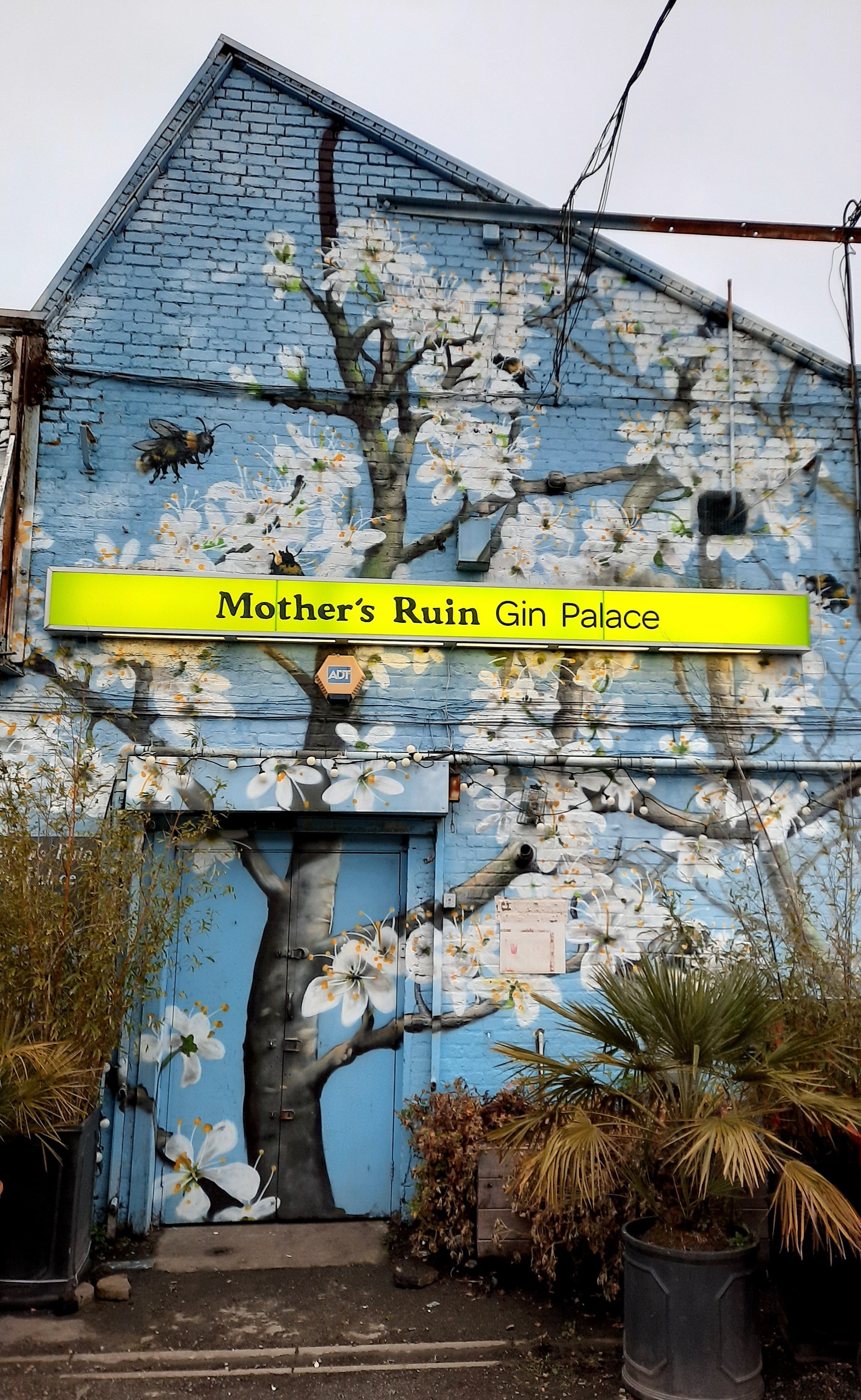 Pillars Brewery at Mother's Ruin Gin Palace with vibrant mural, ideal for events and parties. - Banner