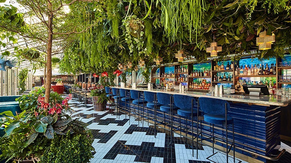 Private dining venue with lush greenery at SUSHISAMBA Covent Garden for events and gatherings.