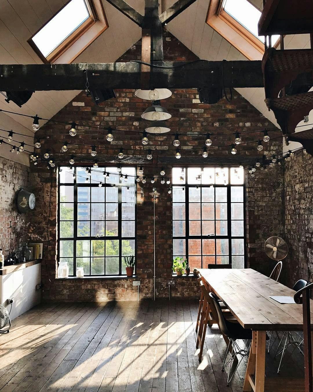 Private dining space with exposed brick walls, perfect for meetings and social gatherings. - Banner