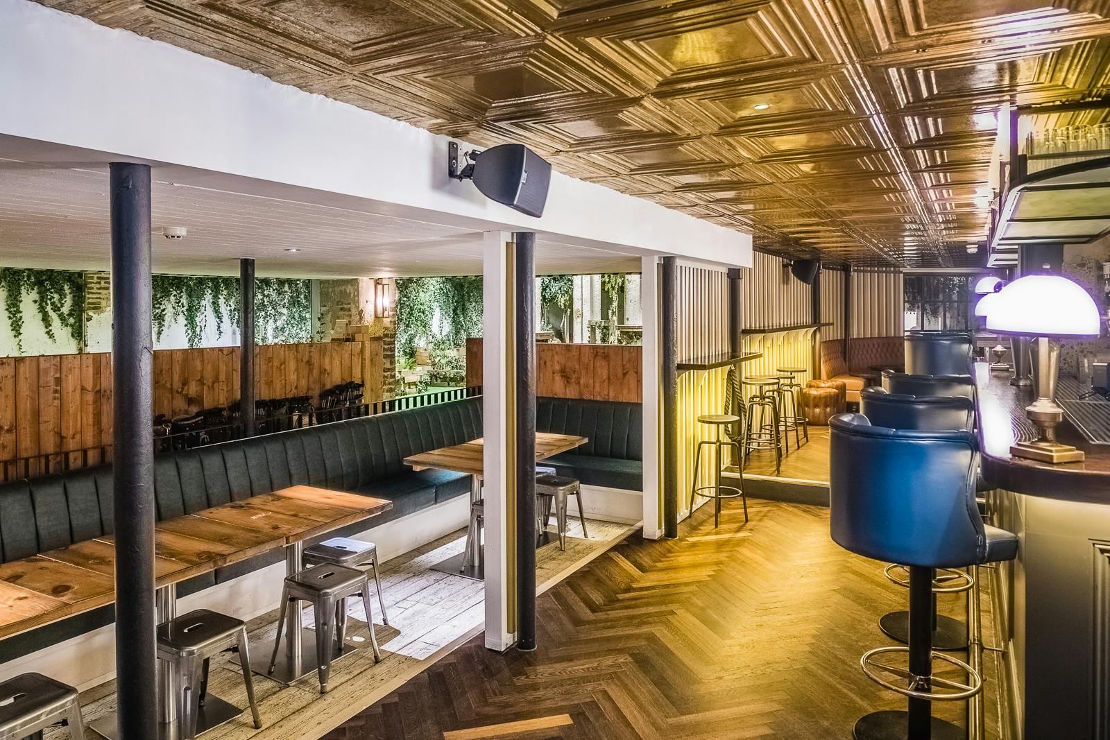 Modern event space with wooden accents, perfect for networking and intimate gatherings.