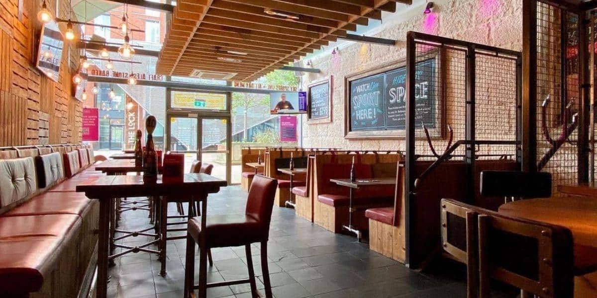 Modern pub venue with cozy seating, ideal for casual meetings and networking events.