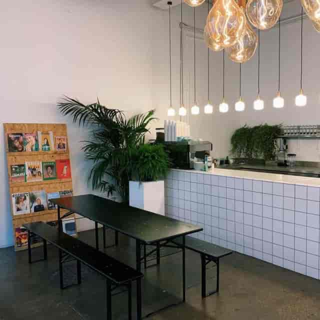 Modern bar at Beechhall Coffee Co. with communal seating for networking events.