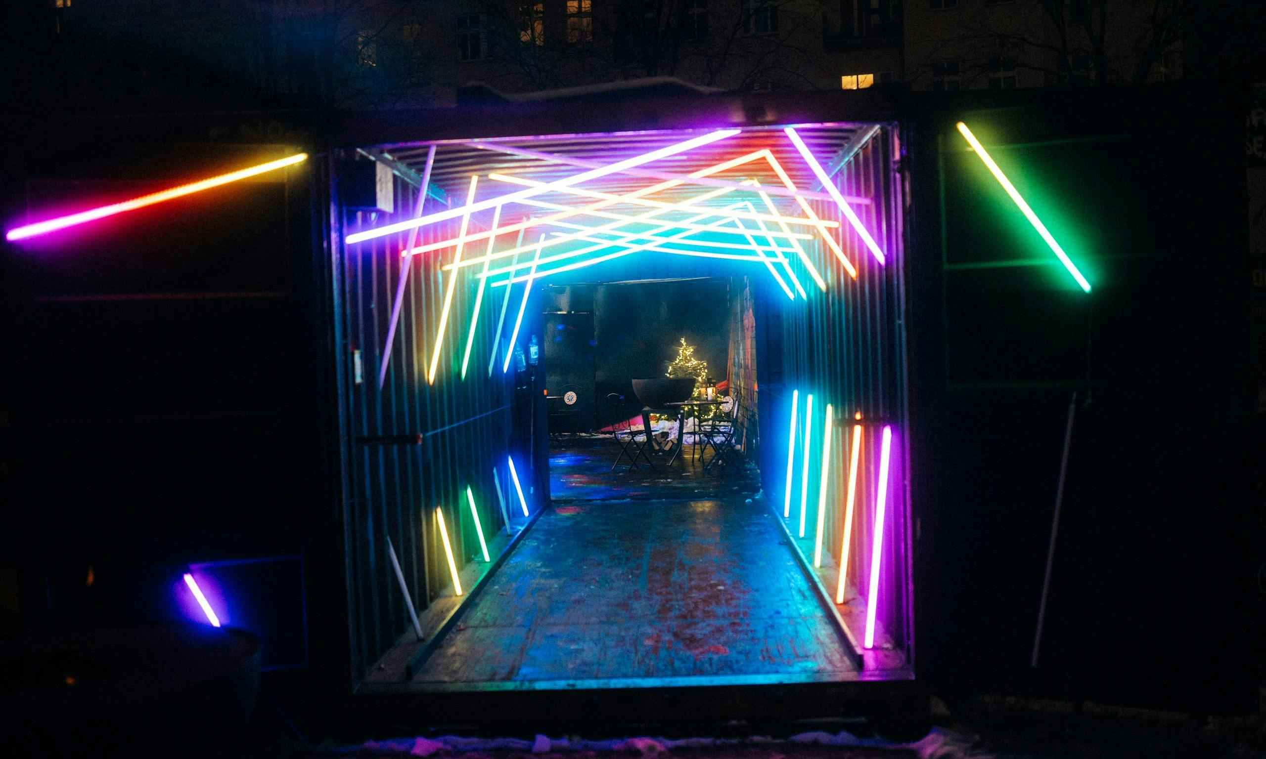 Vibrant neon-lit entrance at TABULA RASA for engaging modern events.