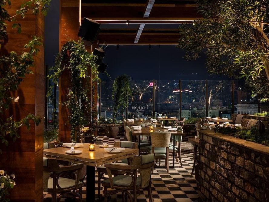 Elegant dining lounge with city views, perfect for upscale events and gatherings.