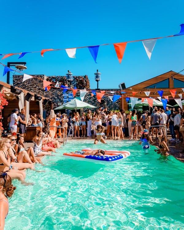 Vibrant pool party at The Highlight Room, perfect for summer events and networking.