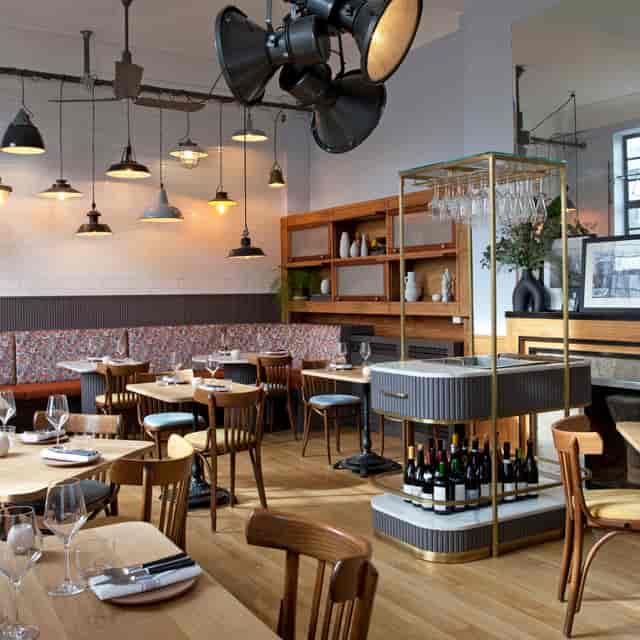 Stylish Eli's Restaurant interior with warm lighting, perfect for events and meetings.