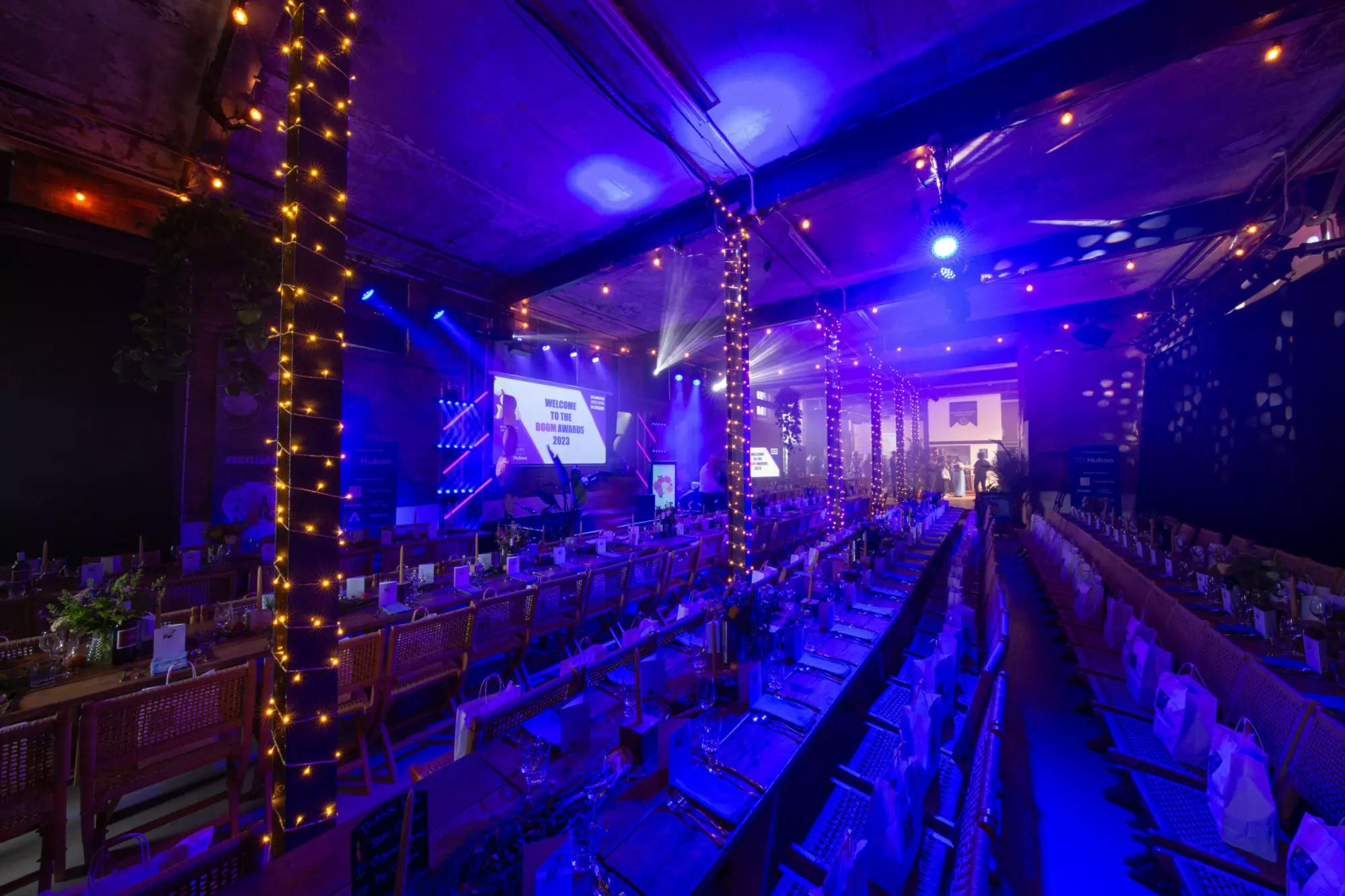 Elegant event space in Box7 with blue lighting, perfect for corporate events and galas.