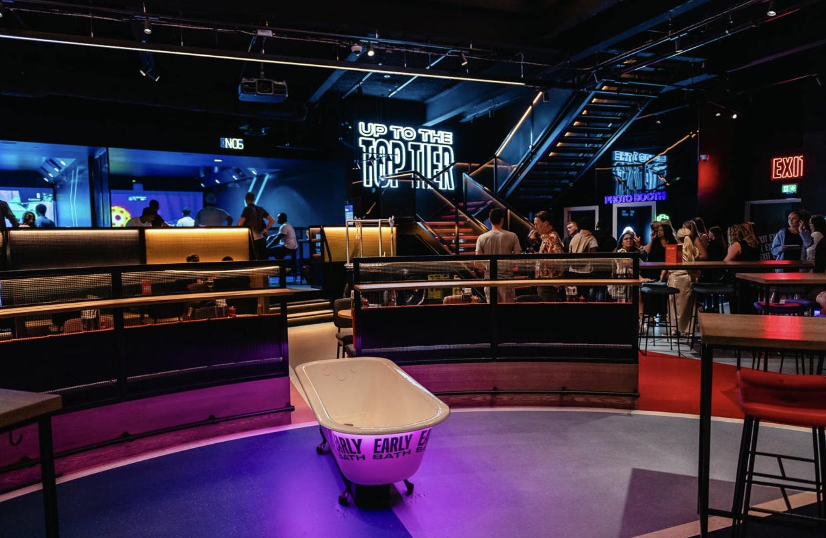 Vibrant TOCA Social venue with central bar, perfect for networking events and celebrations.
