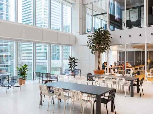 Modern event space in Churchill Place with large windows, ideal for networking and meetings.