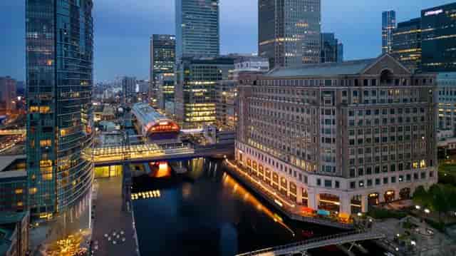 Vibrant Canary Wharf skyline at dusk, ideal for corporate meetings and events.