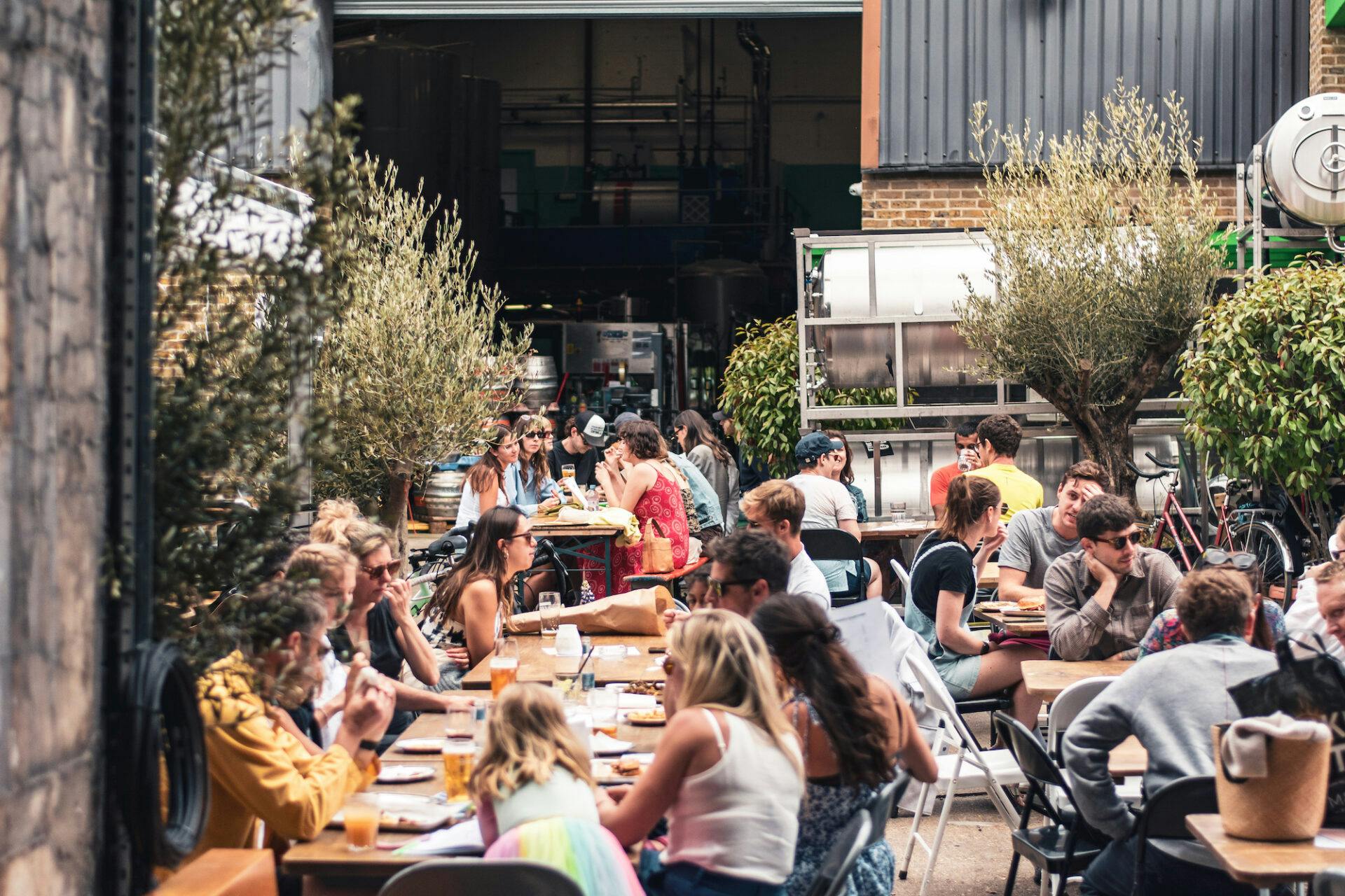 Vibrant outdoor courtyard at Five Points Taproom for casual networking events.