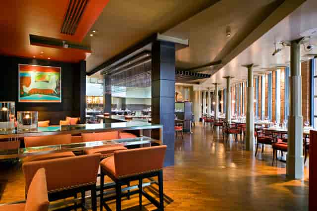 Private dining room at Amaya Grill, modern decor for corporate events and celebrations.