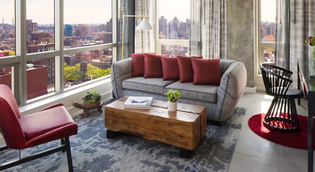 Stylish lounge at Hotel 50 Bowery, ideal for networking events with city views.