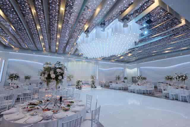 Elegant Manchester Banquet Hall ballroom with shimmering ceiling, perfect for weddings and events.