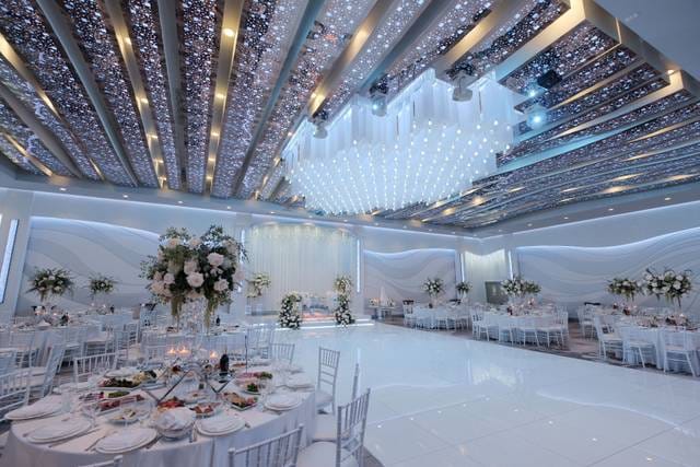Elegant Manchester Banquet Hall ballroom with shimmering ceiling, perfect for weddings and events.