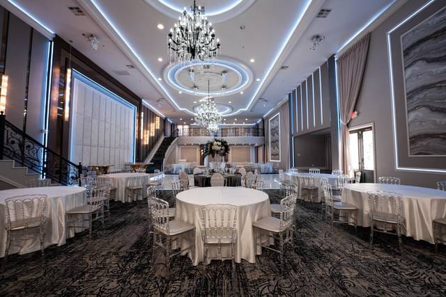 Elegant Manchester Banquet Hall ballroom with round tables, ideal for weddings and corporate events.