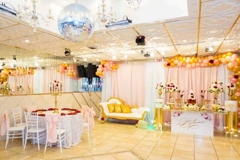Elegant Queens Event Hall with pink and gold decor for weddings and celebrations.