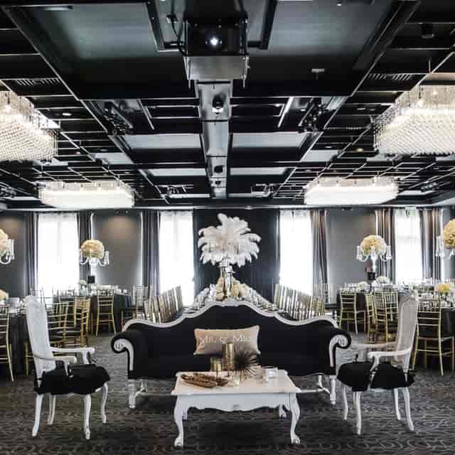 Elegant banquet hall with crystal chandeliers, perfect for weddings and corporate events.