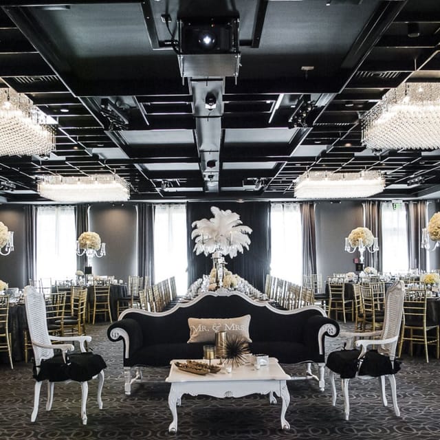 Elegant banquet hall with crystal chandeliers, perfect for weddings and corporate events.