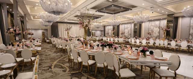 Elegant Legacy Ballroom with floral centerpieces, perfect for weddings and galas.