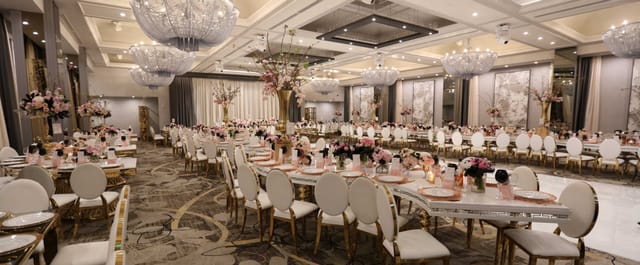 Elegant Legacy Ballroom with floral centerpieces, perfect for weddings and galas.