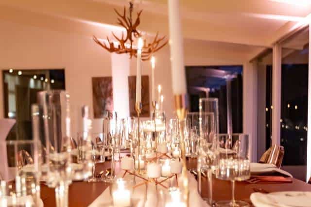 Elegant dining table with antler decor at Blomgren Ranch for upscale events.