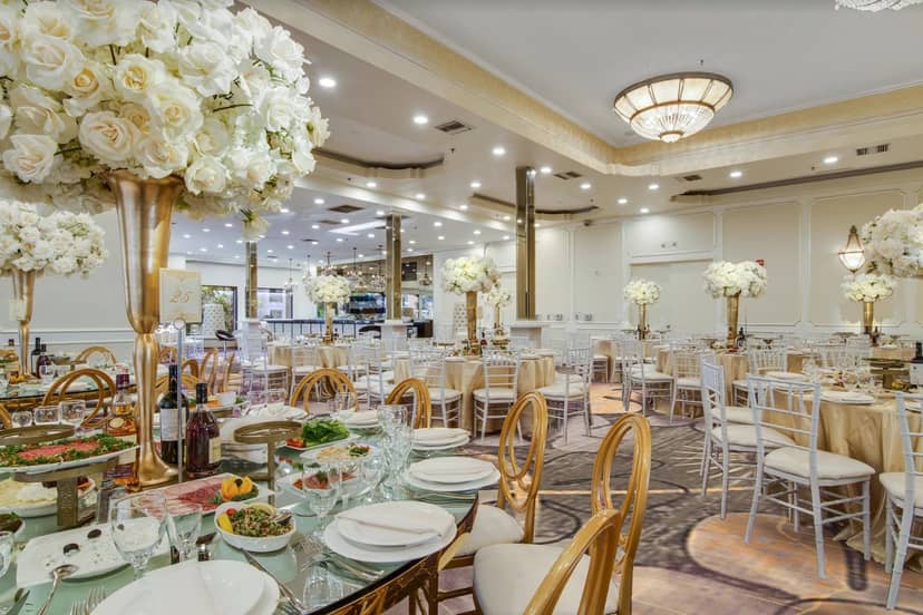 Elegant Brandview Ballroom with tall floral centerpieces for weddings and corporate events.
