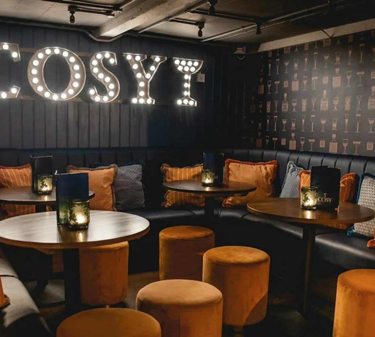 Cozy Cocktail Bar with warm lighting, ideal for networking events and gatherings.