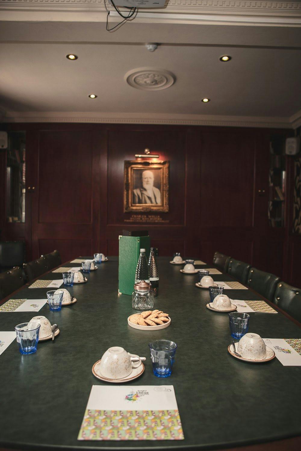 The Boardroom at Somers Town Coffee House, polished table, ideal for meetings and gatherings.