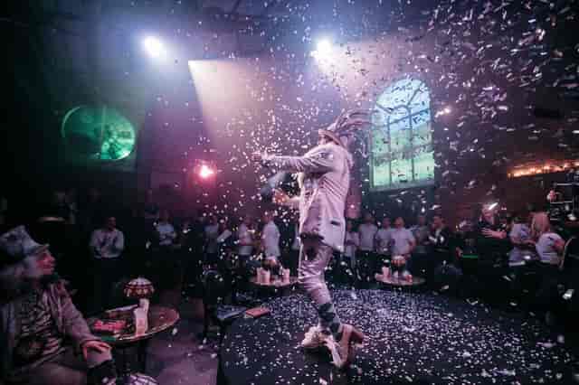 Vibrant performer in confetti at Village Underground event, ideal for corporate celebrations.
