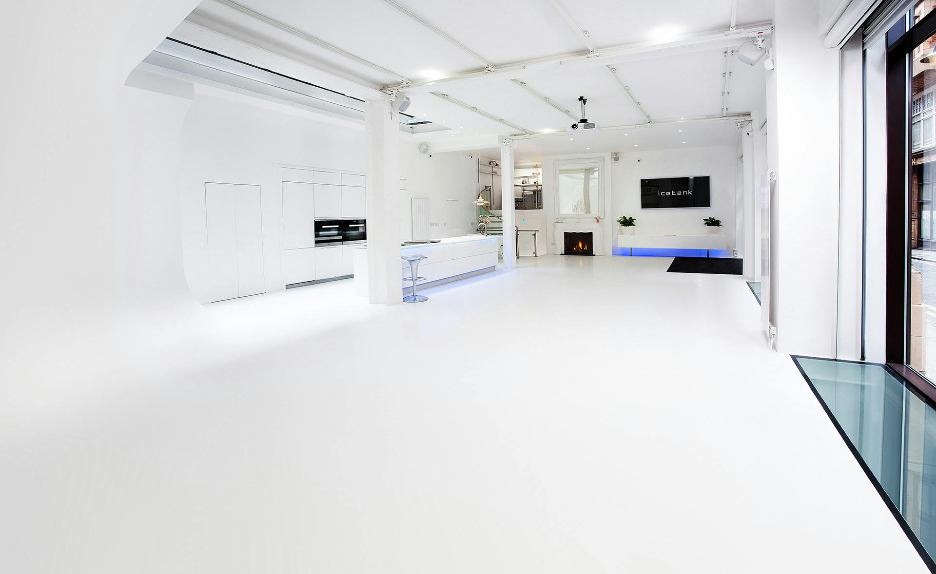 Modern event space with bright white floors for product launches and press events.