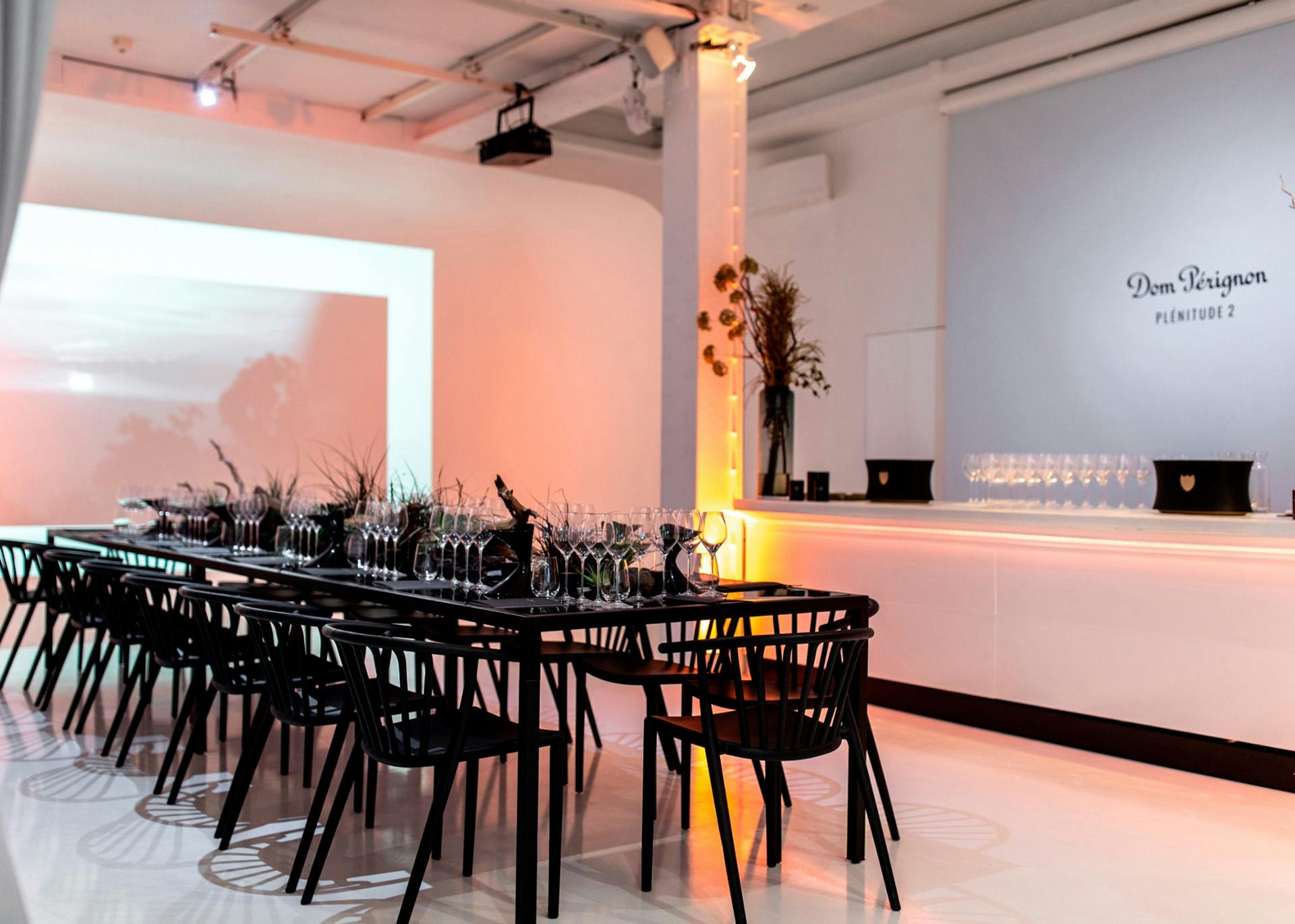 Private dining space with elegant table setting for corporate events and presentations.