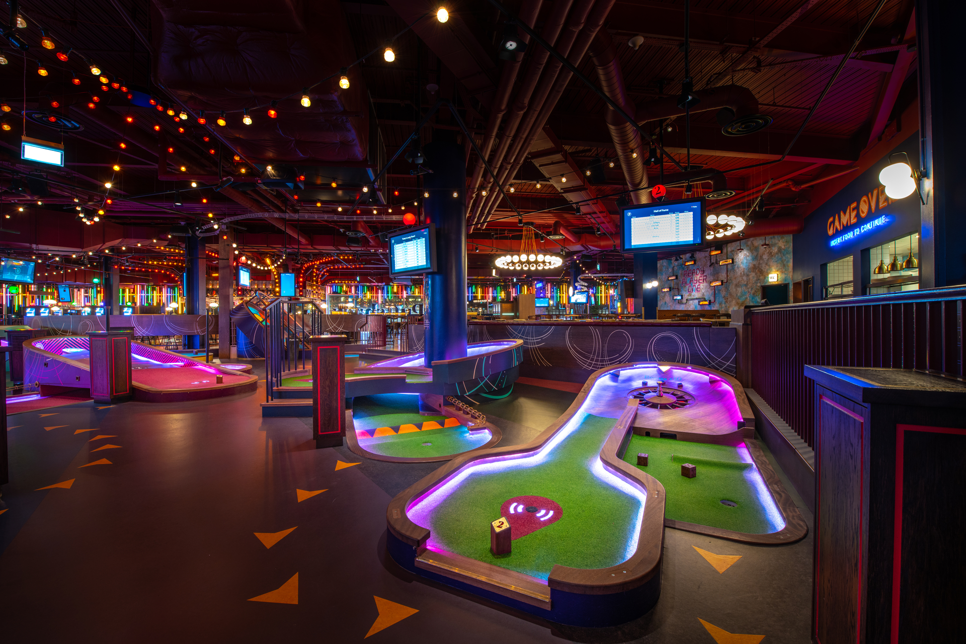 "Vibrant indoor mini-golf venue for Christmas corporate events and gatherings." - Banner
