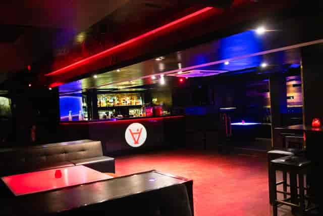 Sleek event space with ambient lighting for private parties and networking events.