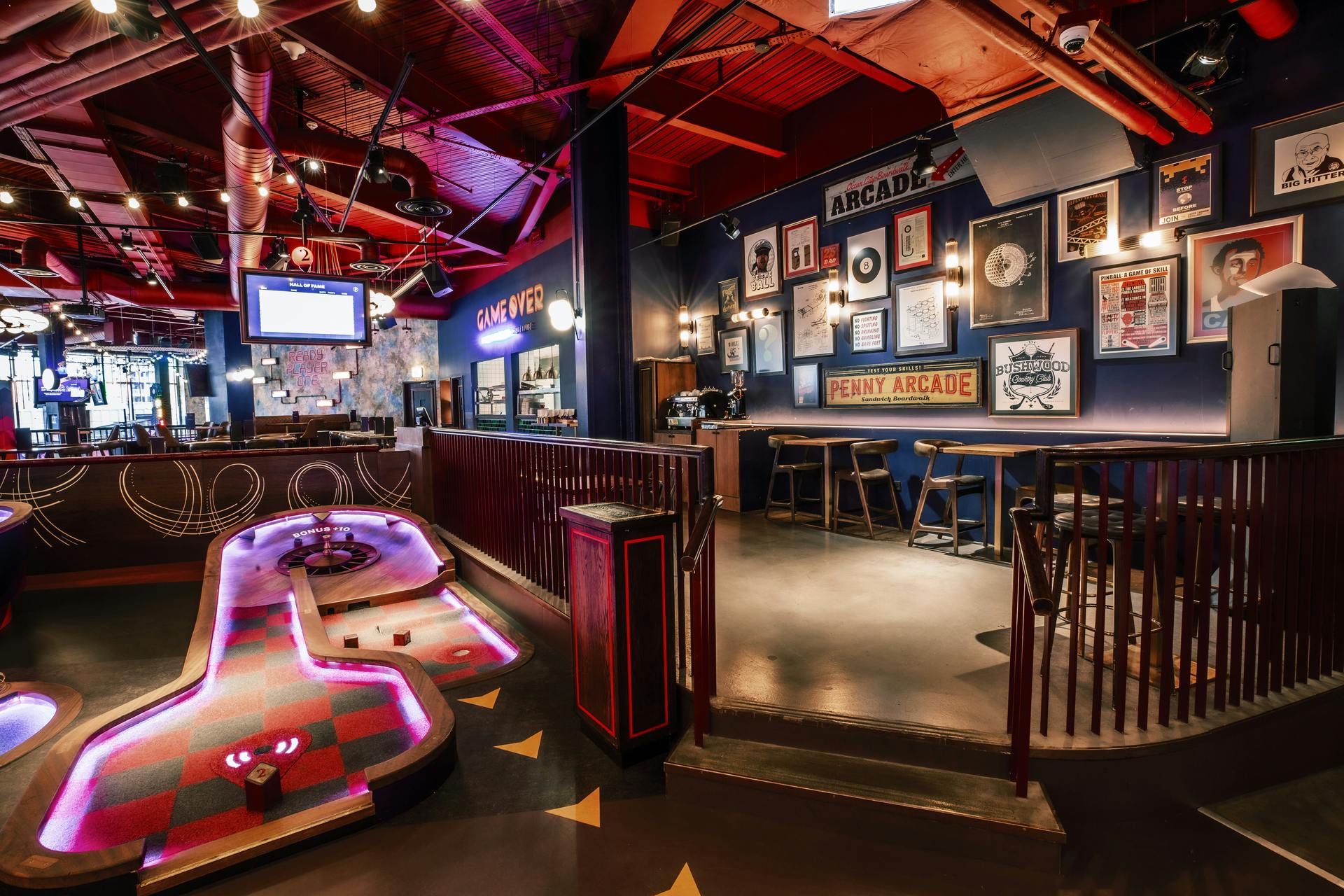"Christmas event space with colorful decor and mini-golf at Puttshack White City."