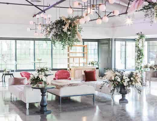 Elegant event space at Casita Hollywood with stylish lounge seating and floral decor.
