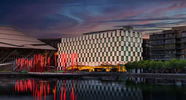 Modern Marker Suite at Anantara Dublin, ideal for events with vibrant lighting and greenery.