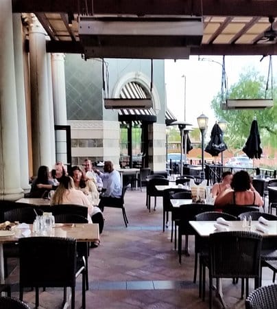 Outdoor dining area at The Cheesecake Factory, perfect for casual meetings and networking.