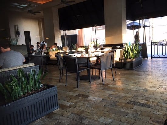 Modern patio dining area at The Cheesecake Factory, perfect for casual meetings and events.