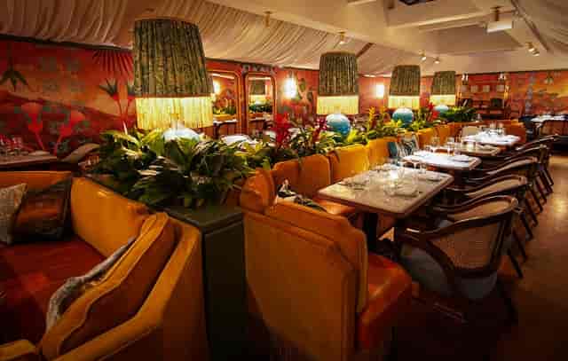 Fine dining restaurant in Olivetta with lush greenery, perfect for events and gatherings.