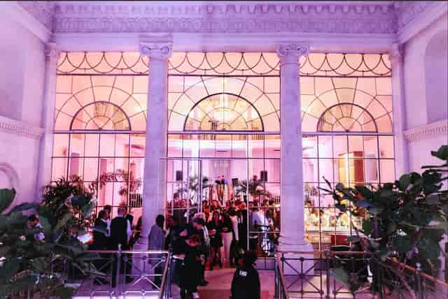 Elegant Courtroom Bar event space with large windows, perfect for networking and celebrations.