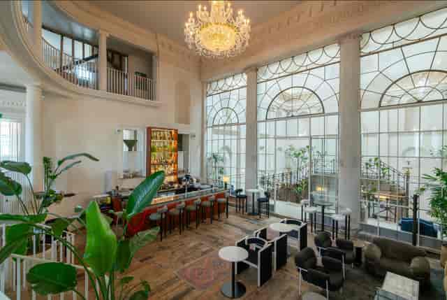 Sophisticated event space with elegant bar, ideal for networking and receptions.