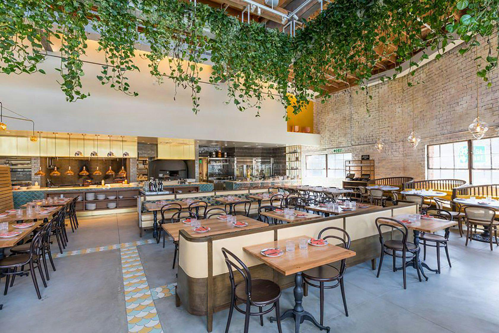 Modern covered patio at Bavel, ideal for gatherings and events with natural light.