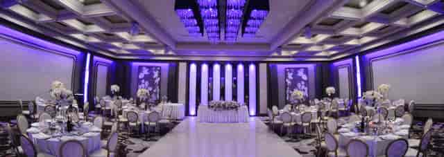 Elegant Main Ballroom with purple hues, ideal for weddings and corporate events.
