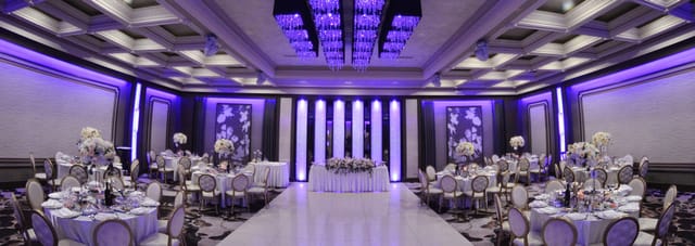Elegant Main Ballroom with purple hues, ideal for weddings and corporate events.