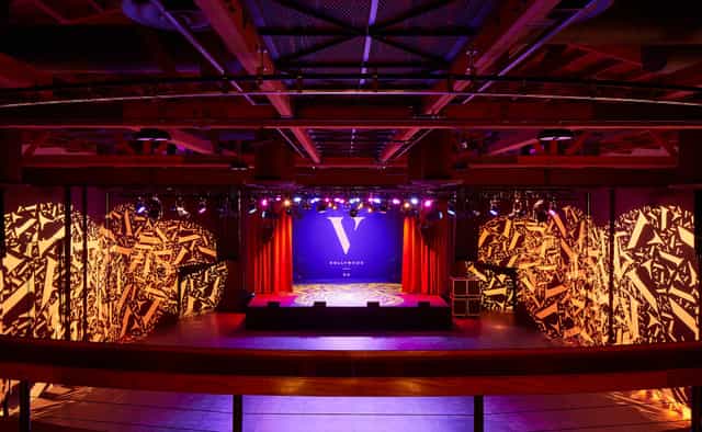 Theater in The Vermont Hollywood with vibrant lighting for conferences and performances.