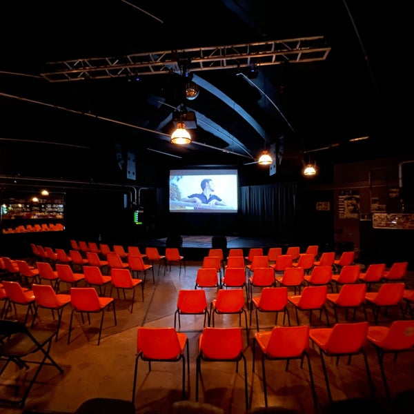 Zebulon Cafe Concert event space with orange chairs for workshops and film screenings.
