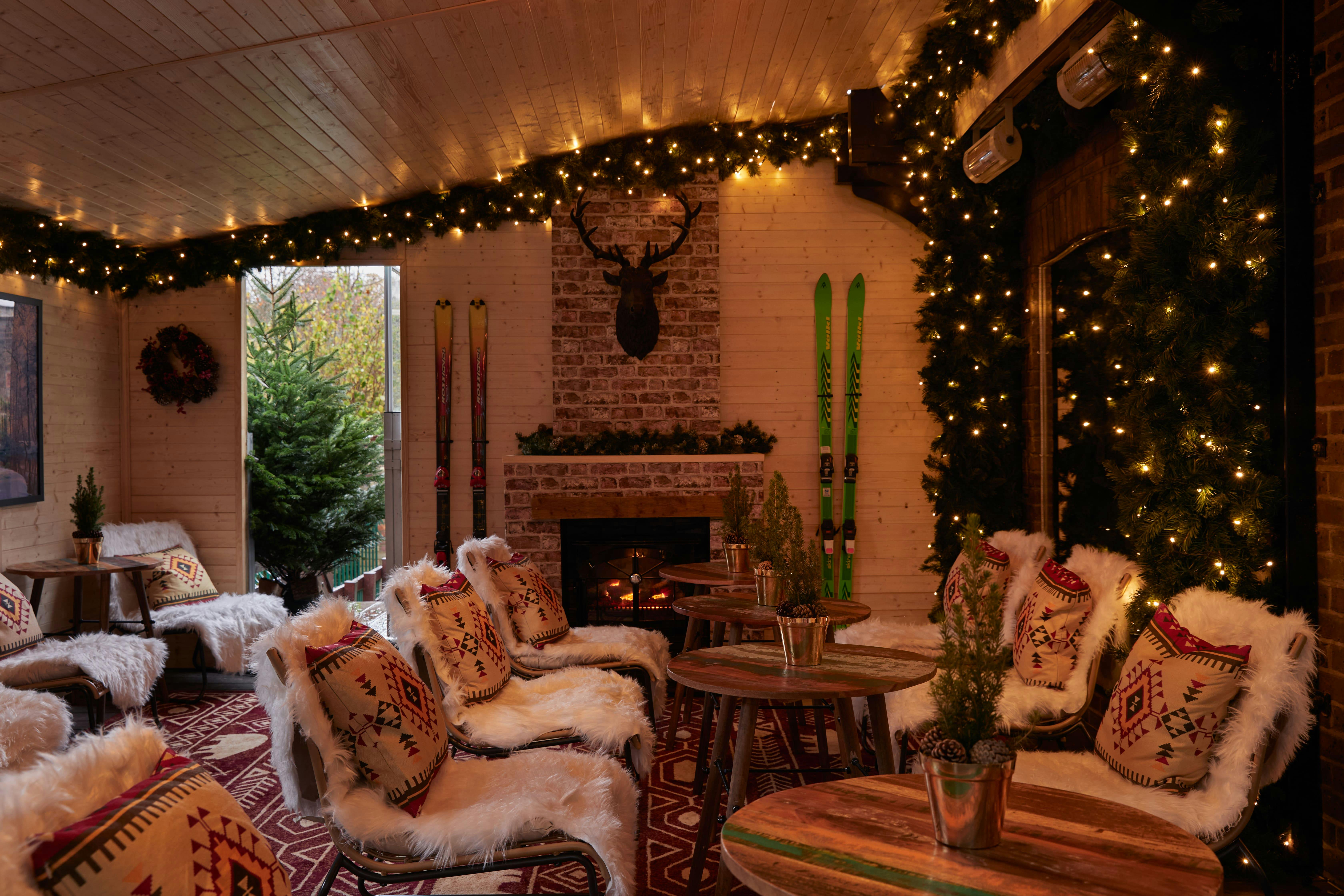 Cozy Winter Lodge event space with rustic decor, perfect for holiday gatherings.