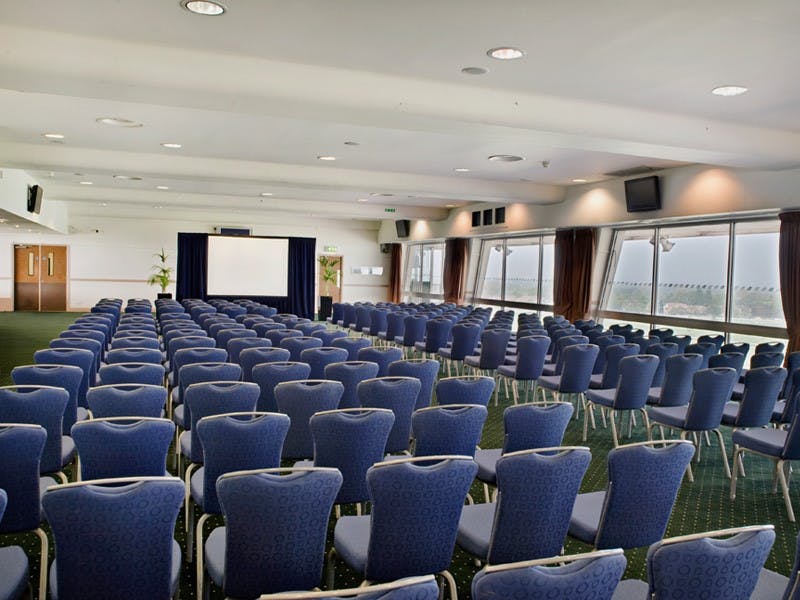 Gold Cup Suite at Sandown Park, blue chairs arranged for a professional presentation.